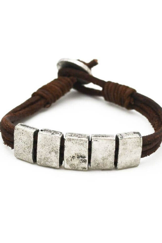 Anju Jewelry Silver Rectangles Leather Brown Bracelet. Shop men’s jewelry for everyday wear. Men’s leather jewelry. Casual men’s jewelry. Popular men’s jewelry styles for casual outfits. Adventurous jewelry for men. Indian jewelry for men. Handmade jewelry for men of all styles. Feel the spirit of India when you wear Anju’s jewelry for men. Genuine leather necklaces and handwoven leather bracelets include metal accents and wooden accents. Easy men’s jewelry with an Indian flair will keep you looking stylish