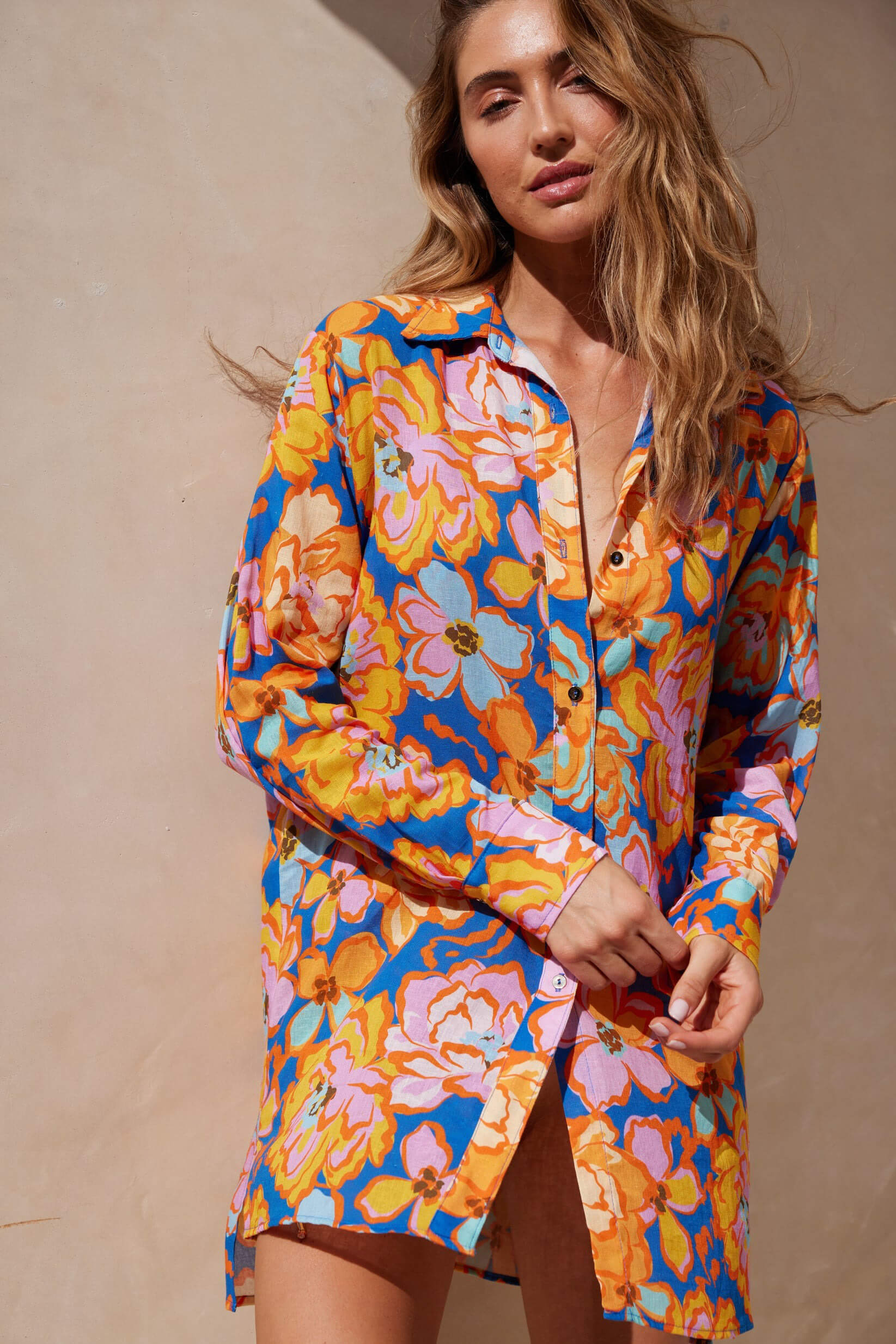 Aquari solara shirt dress in Santorini floral. Aquari bikini top. Aquari bikini bottom. Aquari floral bikini. Aquari floral dress. Beautiful floral dress. Feminine floral dress. Elegant vacation outfits for women. Aquari floral romper. Aquari  Riviera Dress. Aquari Sunrise Romper. Aquari Mira Mini Dress. Aquari Luna dress. Aquari Rio Top. Aquari Rio Bottom. Aquari Oasis Top. Aquari Native Bottom. Aquari Capri Top. Aquari Capri Bottom. Floral bikinis for summer vacation. Romantic floral clothing for women.