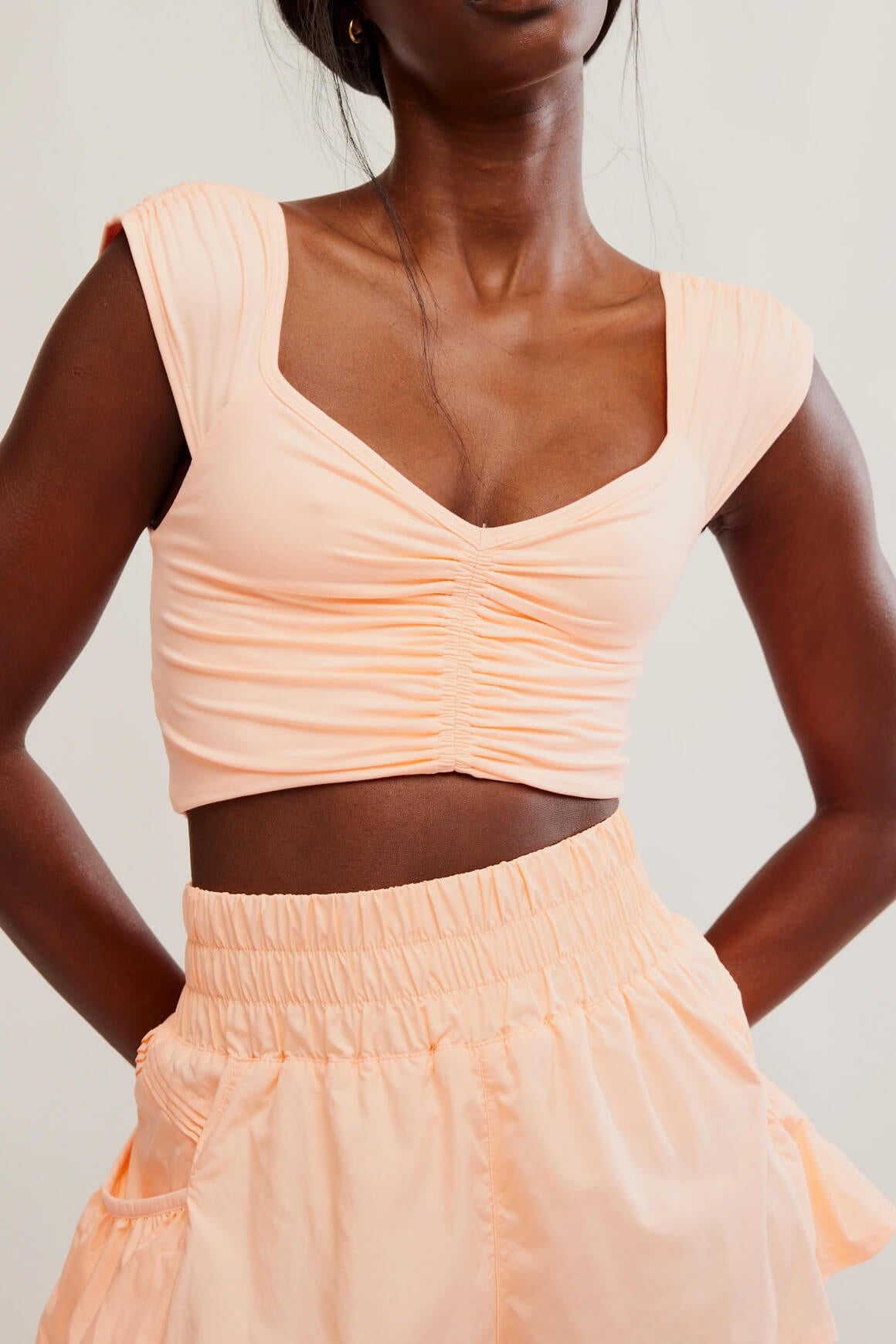 Free People breathe deeper cami in pastel peach