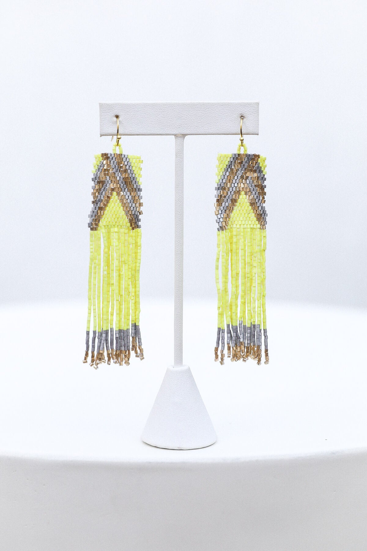 Womens yellow, gold, and silver beaded earrings
