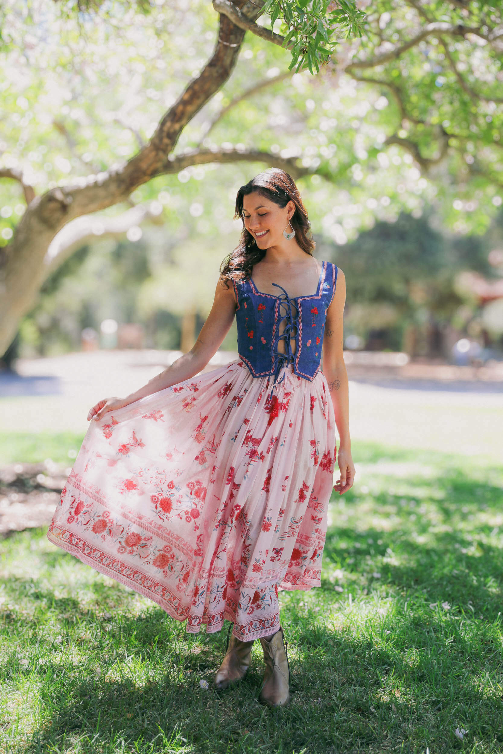 Womens bustier top with pink stitching and embroidered flowers