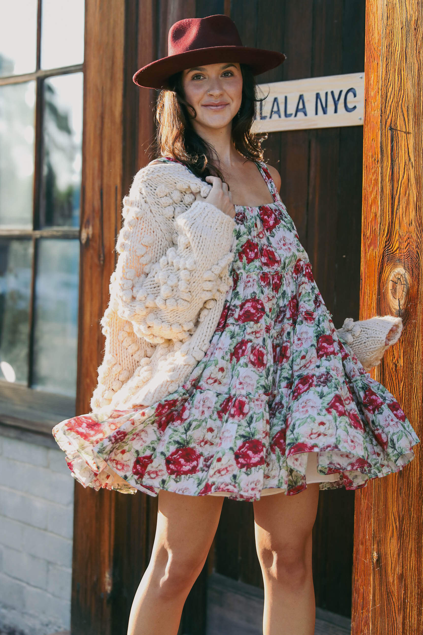 Womens flowy printed mini dress with roses throughout and a slip