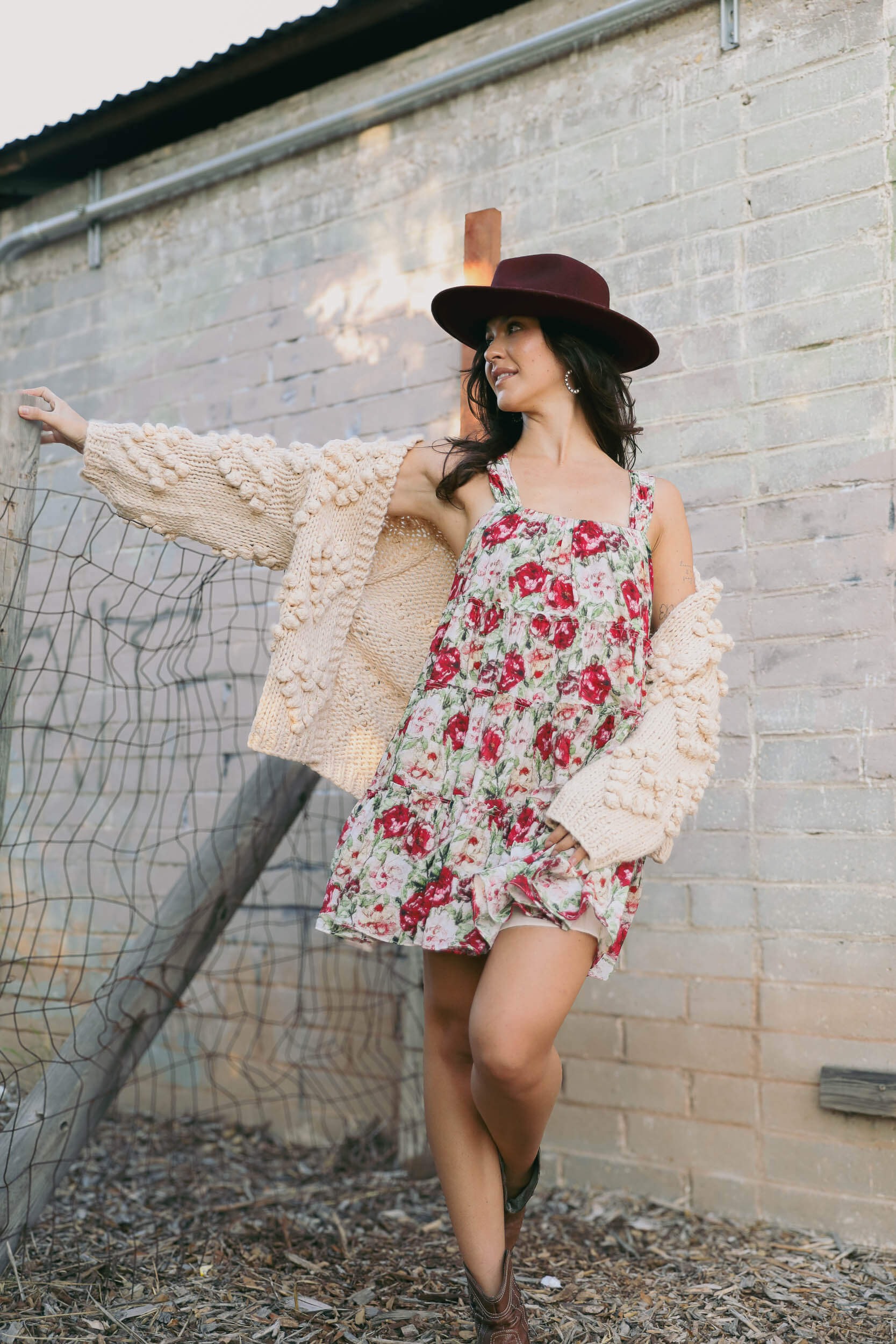 Womens chunky knit cardigan with poms throughout