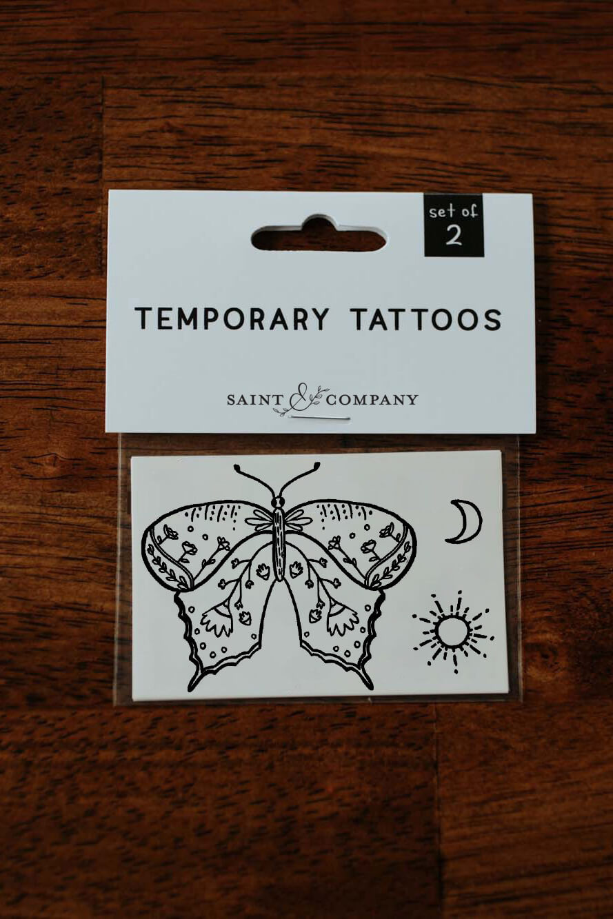 Saint & Company butterfly sun and moon tattoo