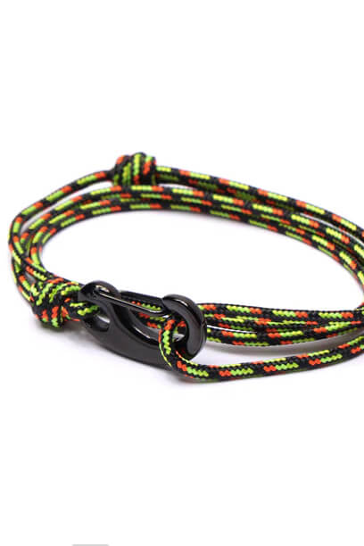 Colorful braided bracelet with a black clasp on a white background