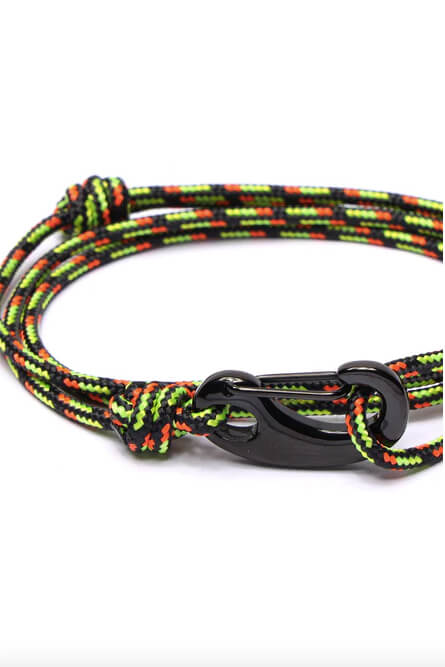 Colorful paracord dog leash with a black metal clasp on a white background