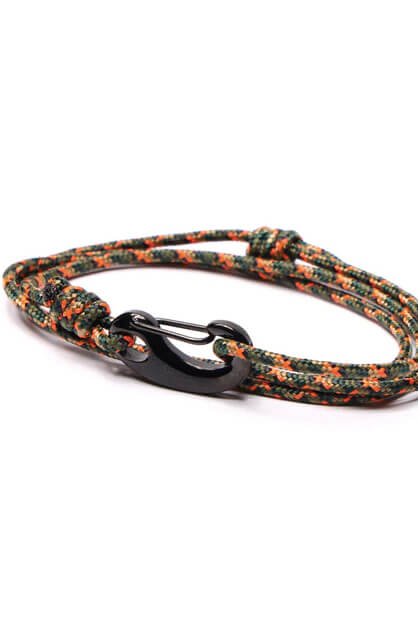 Bracelet with multicolored pattern and black clasp on a white background