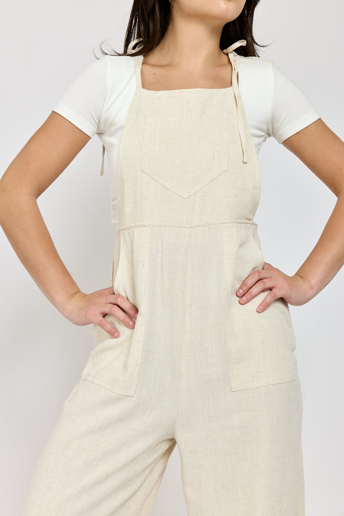 Womens linen jumpsuit with front pockets and adjustable straps