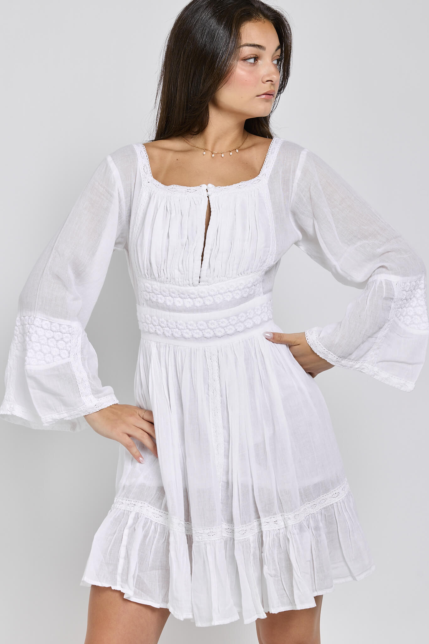 Womens white bell sleevr dress with slip and front keyhole feature, crochet detail, and lace detail