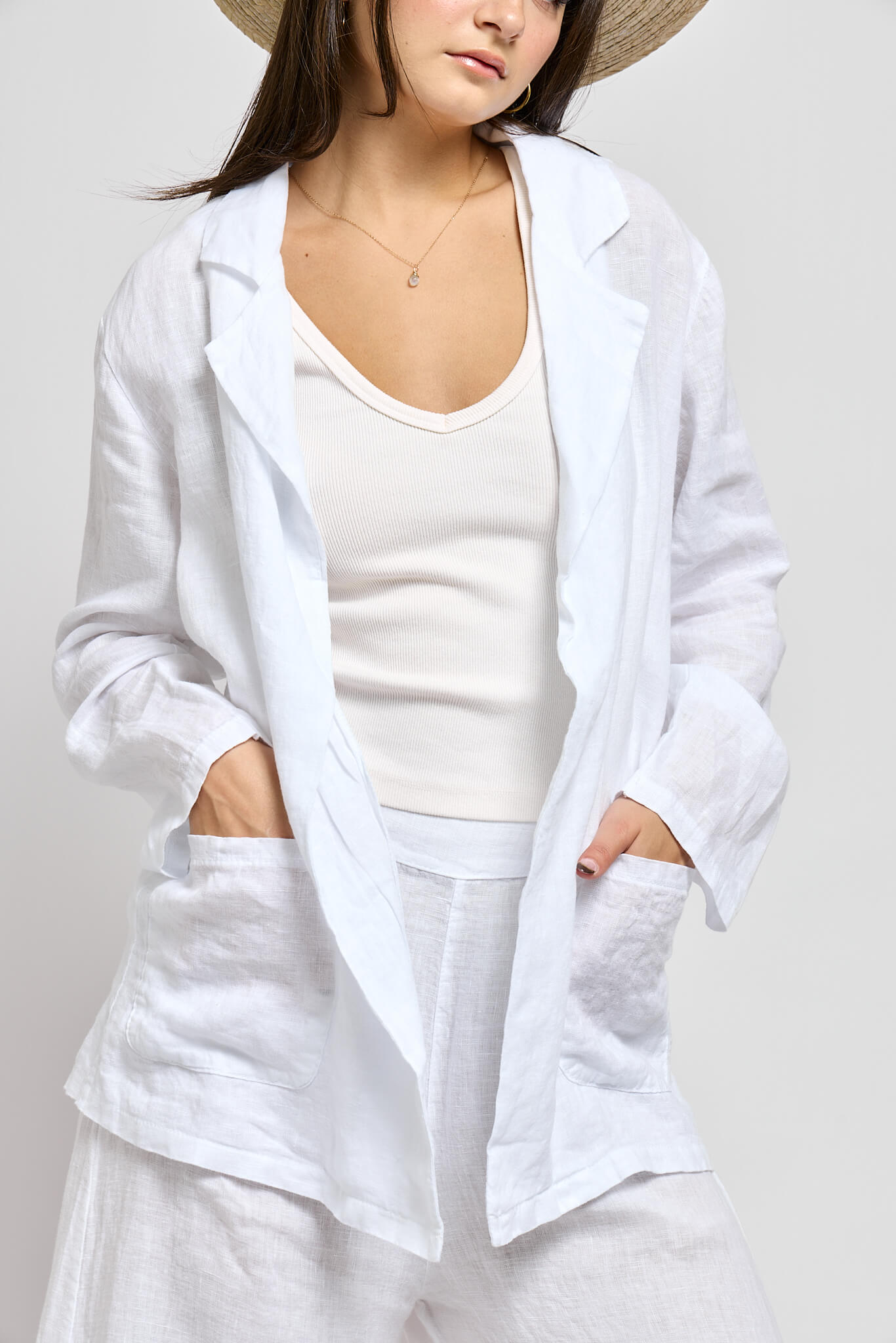 Womens white linen blazer with front from pockets