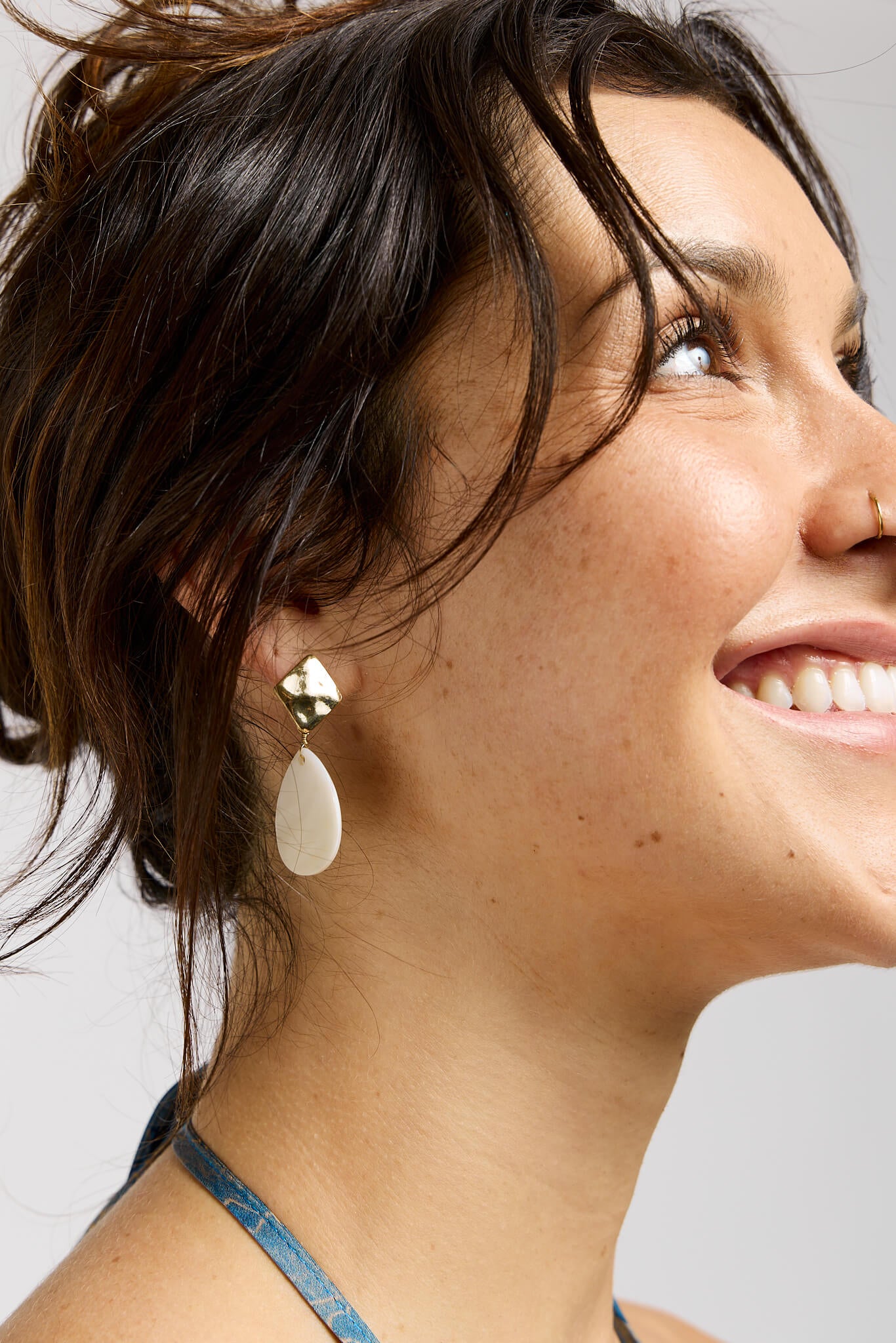 Womens lightweight gold hammered earrings with iridescent dangle