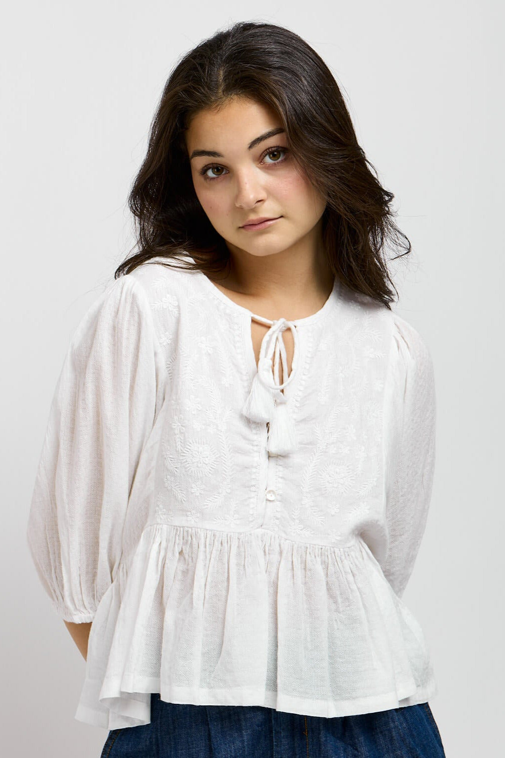 Womens white shirt with bottom ruffle and neck tie