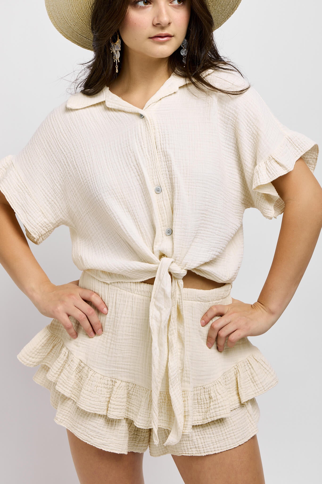 Womens butter color short sleeve top with ruffle detail and collared neck