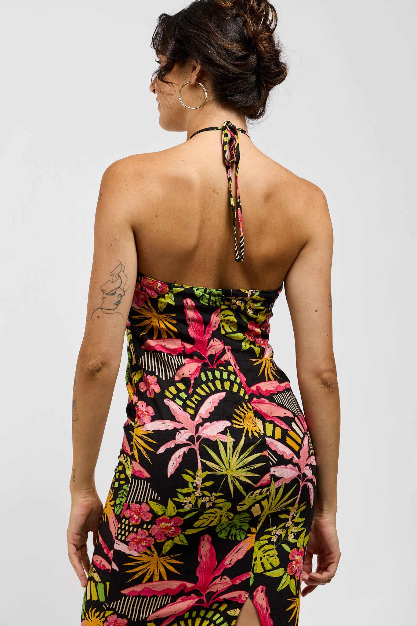 Womens black maxi dress with pink and green tropical print.