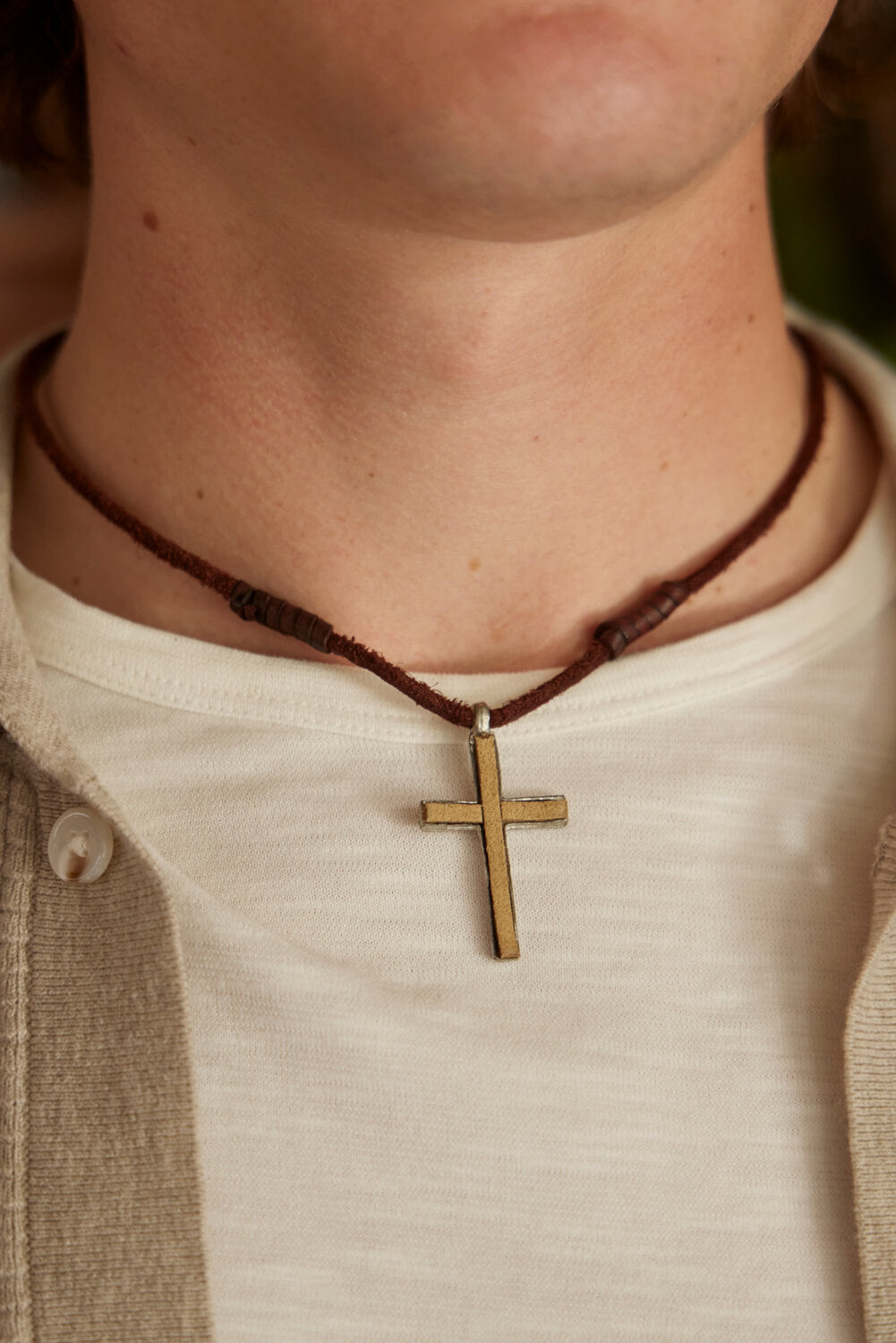 Anju Mens leather cross necklace. Shop men’s jewelry for everyday wear. Men’s leather jewelry. Casual men’s jewelry. Popular men’s jewelry styles for casual outfits. Adventurous jewelry for men. Indian jewelry for men. Handmade jewelry for men of all styles. Feel the spirit of India when you wear Anju’s jewelry for men. Genuine leather necklaces and handwoven leather bracelets include metal accents and wooden accents. Easy men’s jewelry with an Indian flair will keep you looking stylish all day long.
