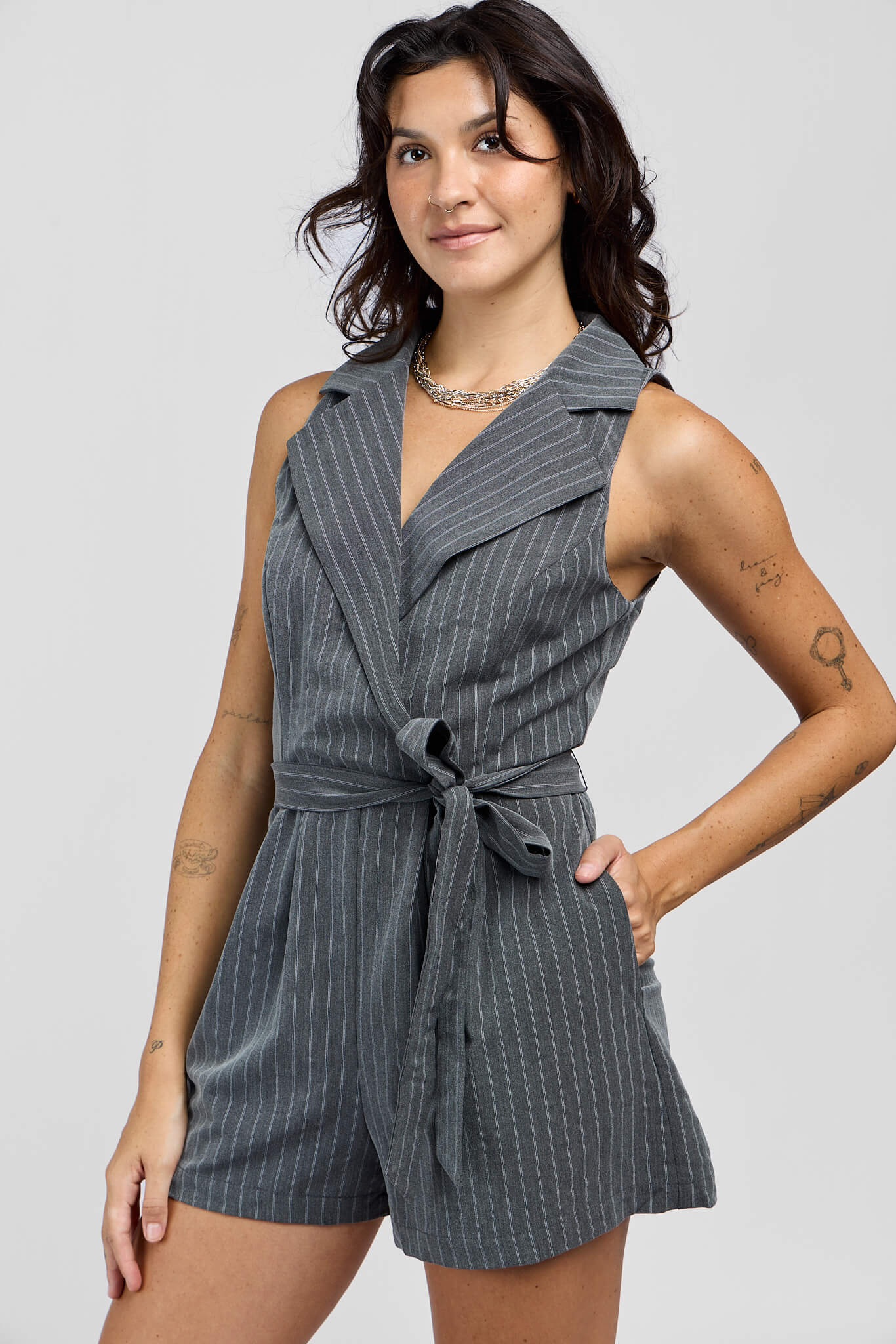 Womens dark grey sleeveless romper with front lapels and waist tie
