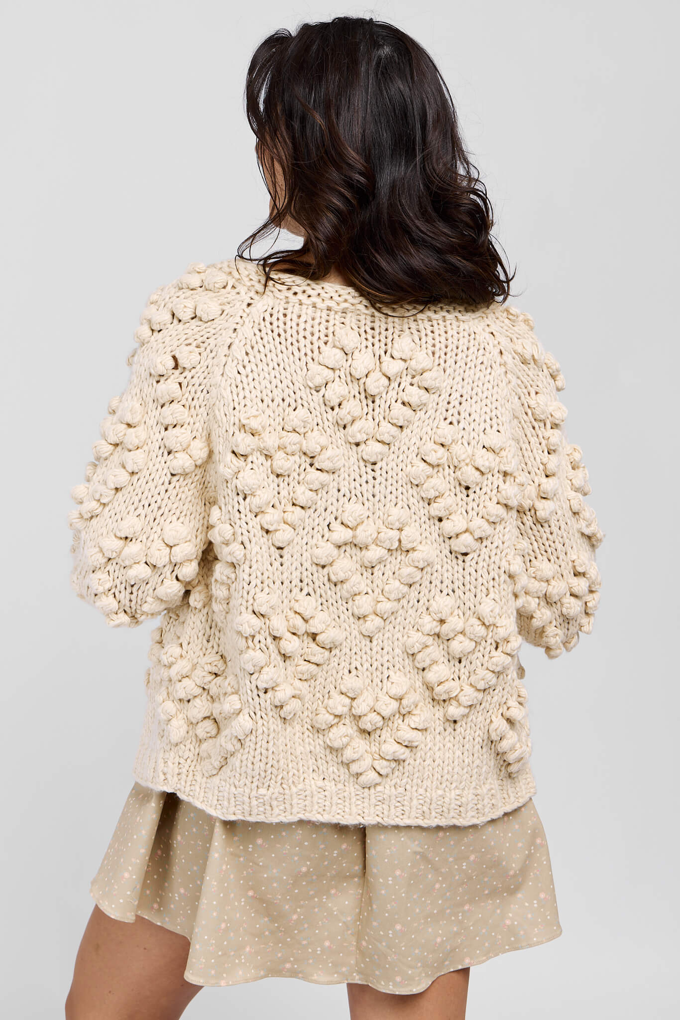 Womens cream chunky cardigan with poms throughout