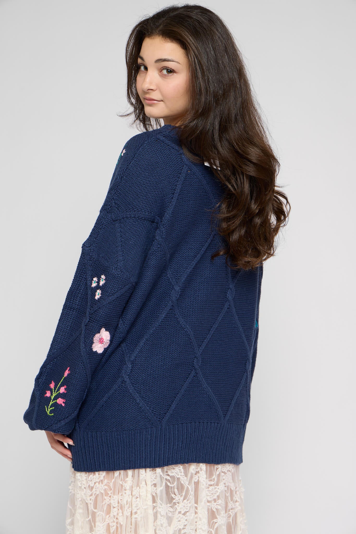 Womens blue sweater with diamond cable pattern
