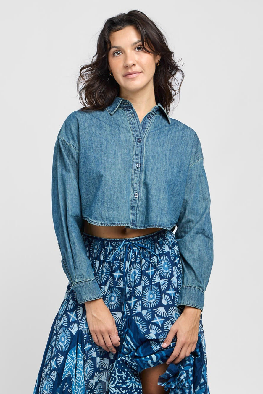 Womens blue denim crop buttonup top with collar, buttonup front, and cuffed sleeves