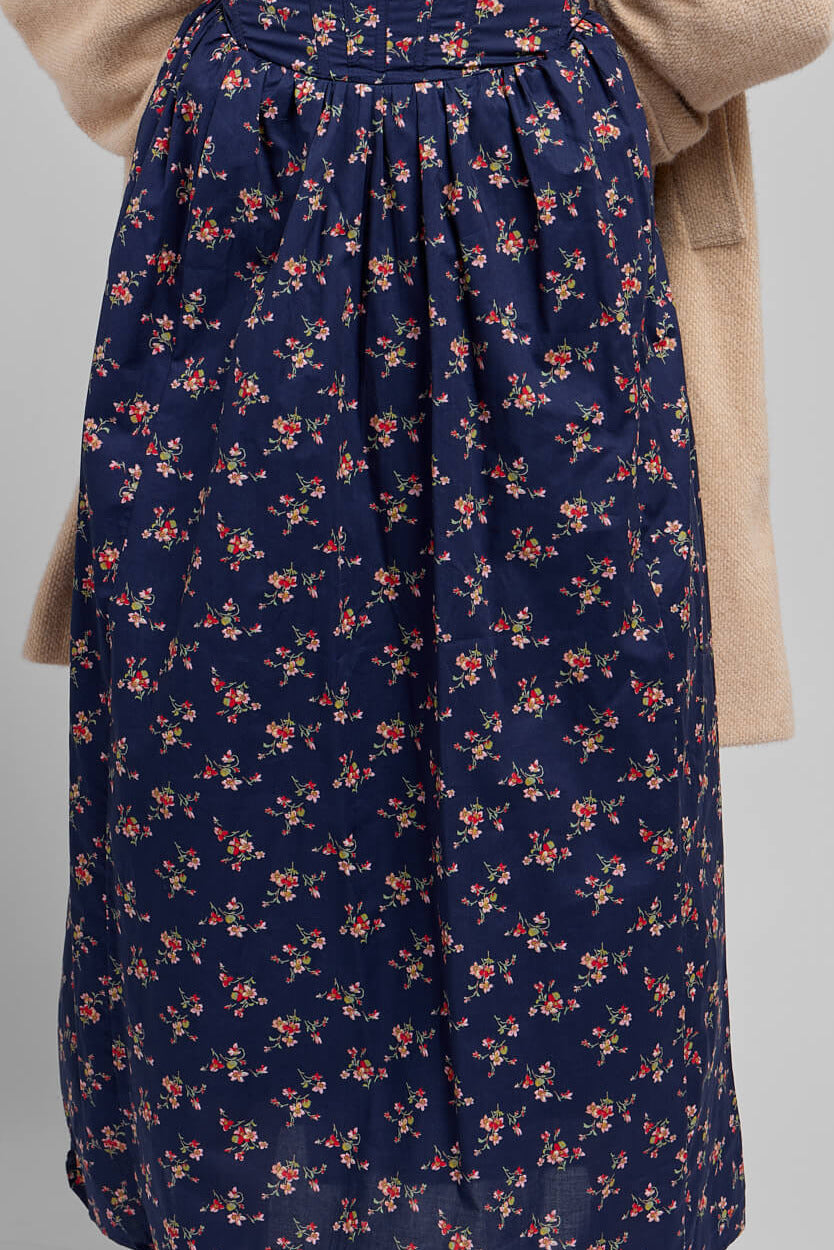 Womens navy dress with pink floral pattern throughout