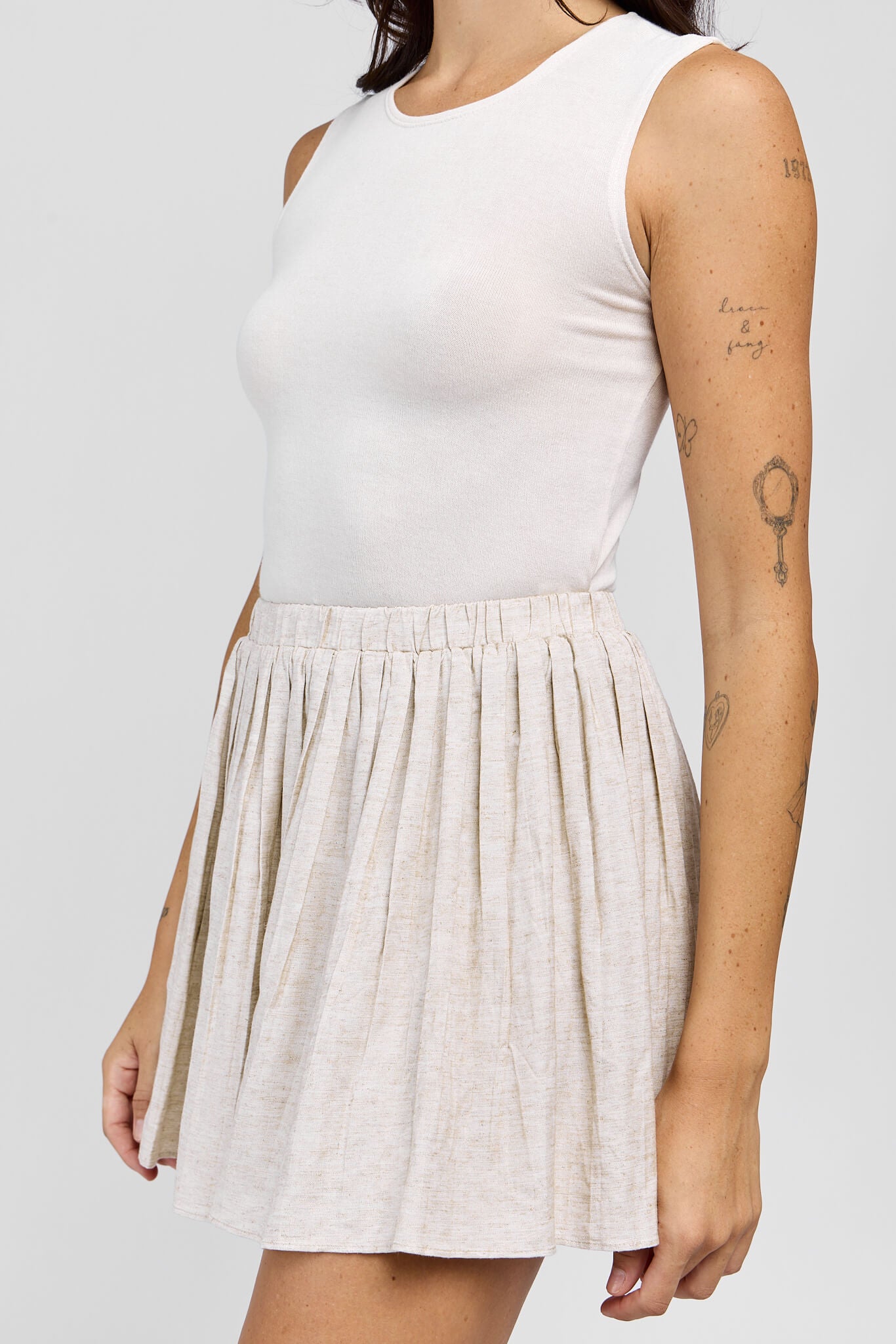 Womens neutral colored mini skirt with stretchy waistband