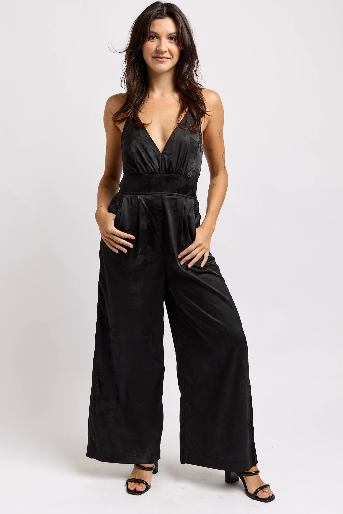 Womens silky v-neck jumpsuit with floral print thoughout