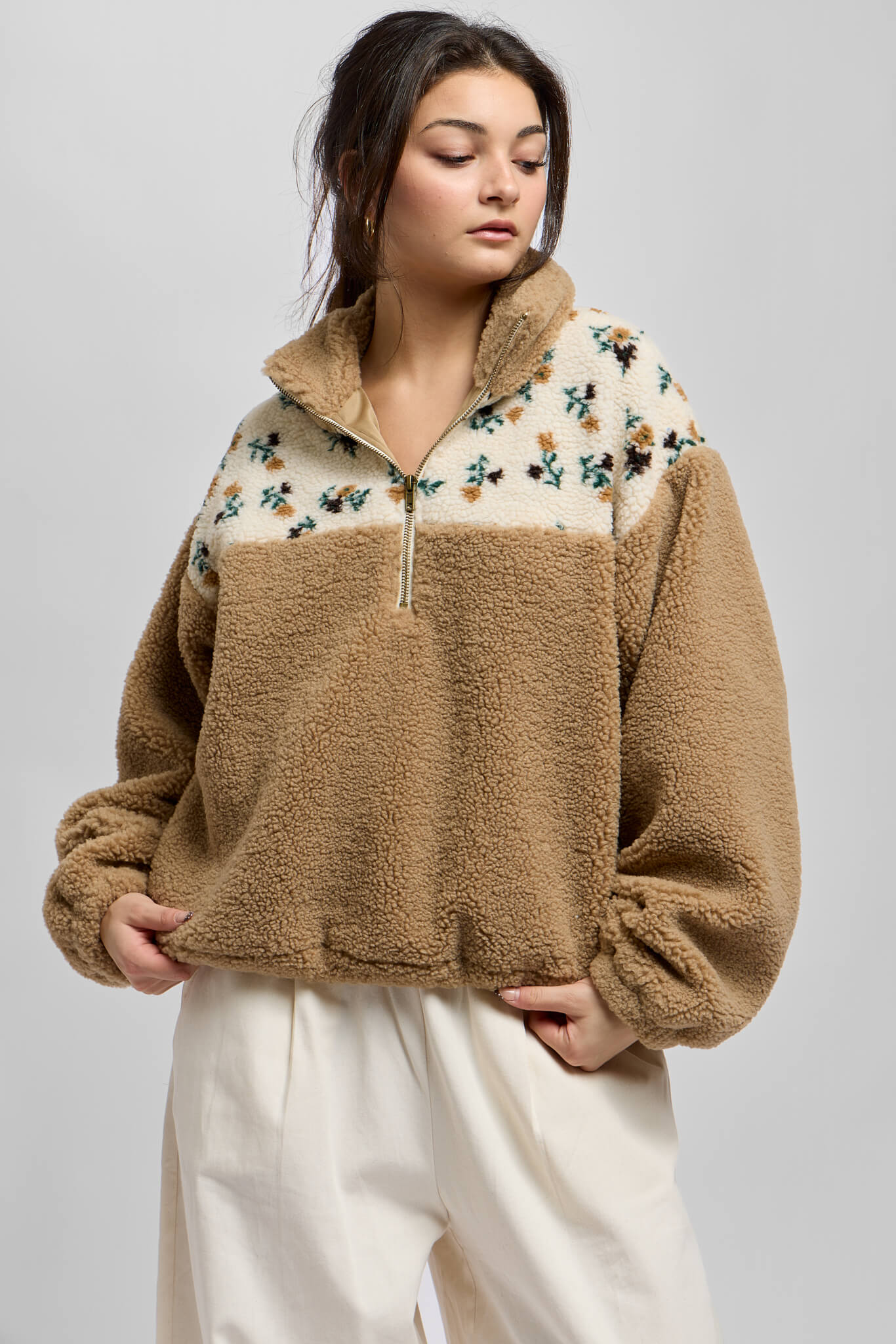 Womens sherpa pullover with floral print details and half zip neckline