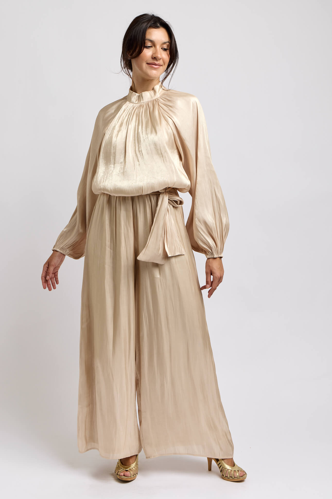 Womens champagne colored jumpsuit with wide leg pant and a waist tie