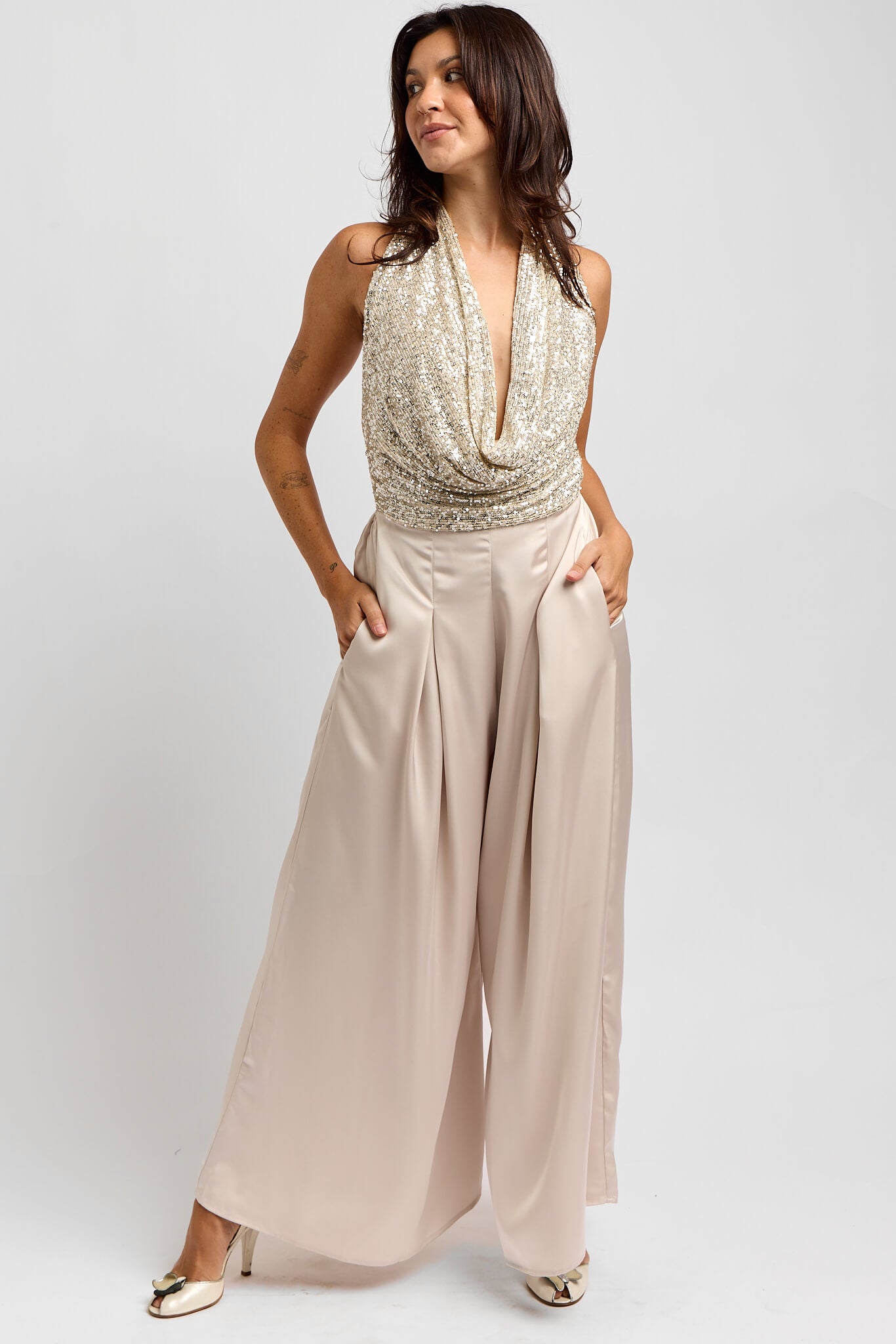 Womens sequin halter top jumpsuit in a champagne color
