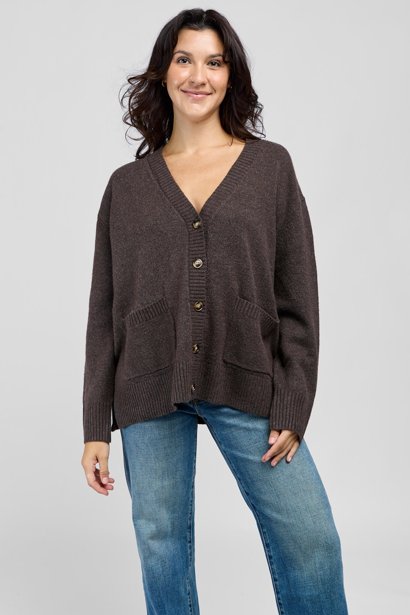 Womens deep brown cardigan with two front pockets, button closure, and v-neckline