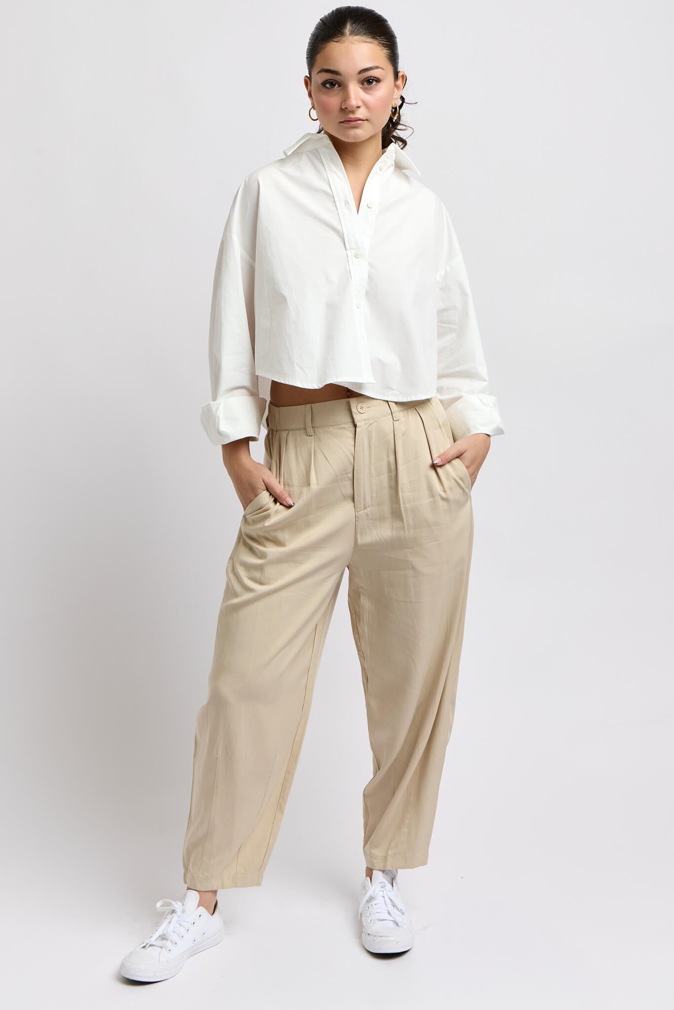 Womens pants with pleating at top and button and zipper closure