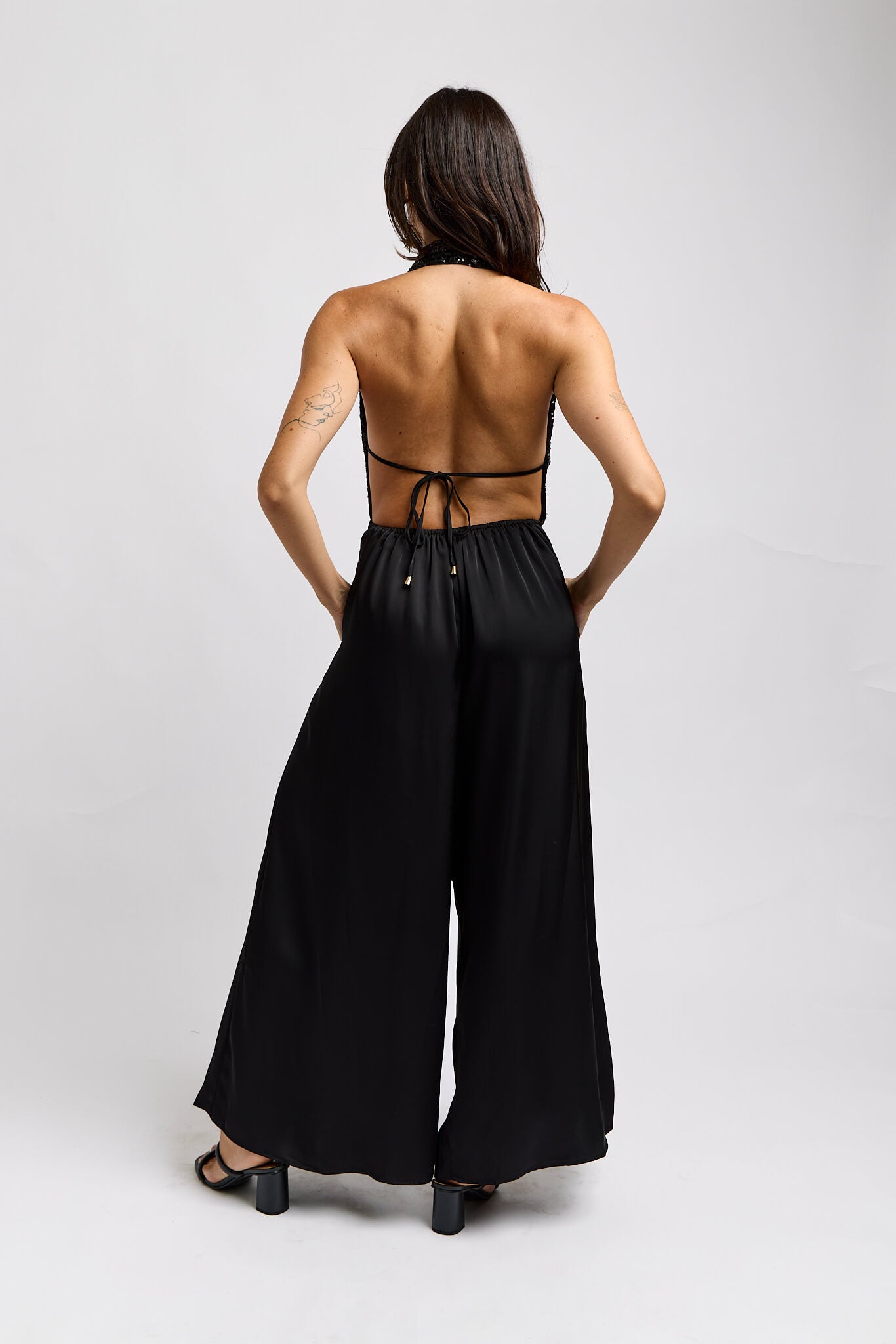 Womens halter jumpsuit with open back and dainty back tie detail