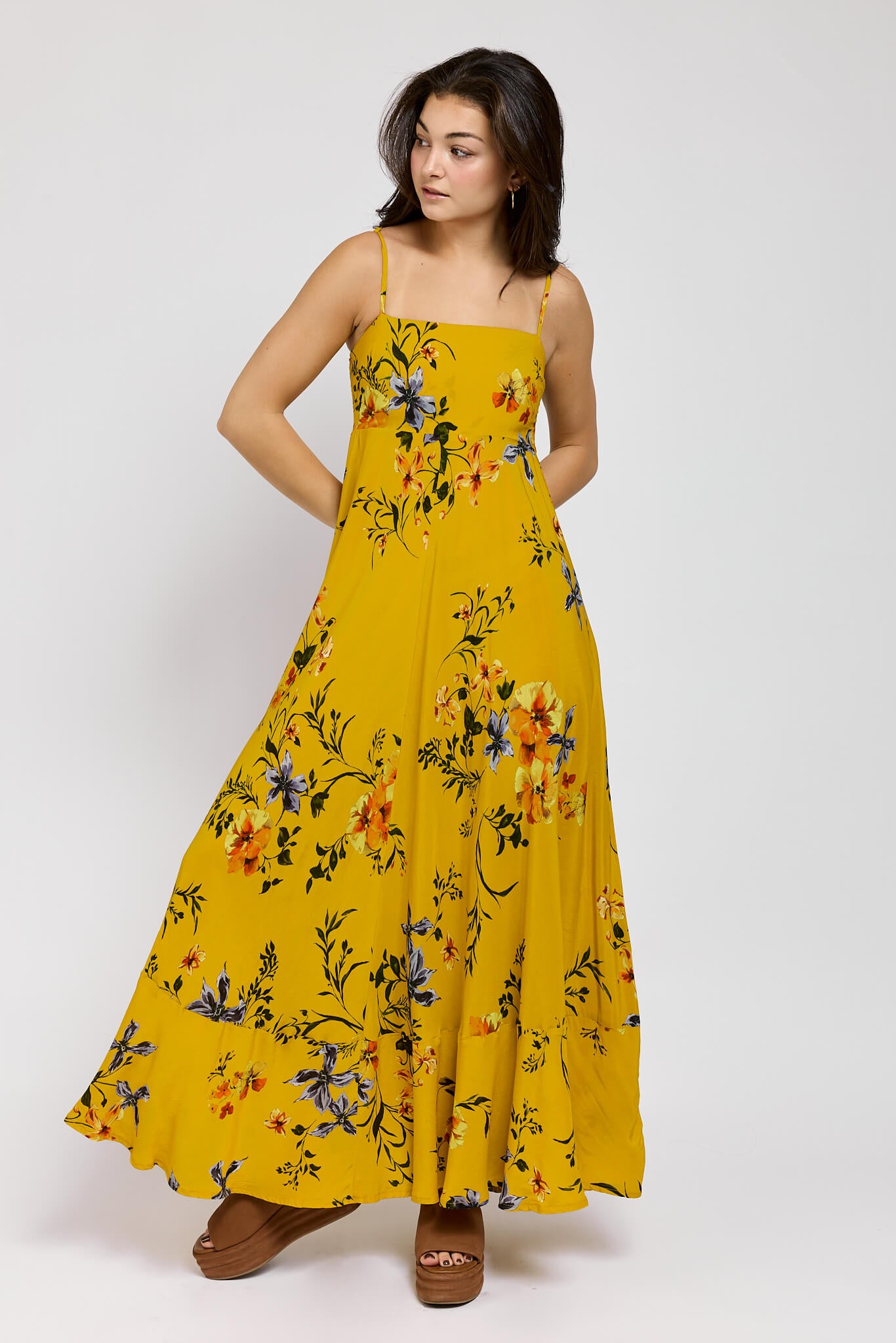 Womens flowy yellow dress with adjustable straps and floral pattern
