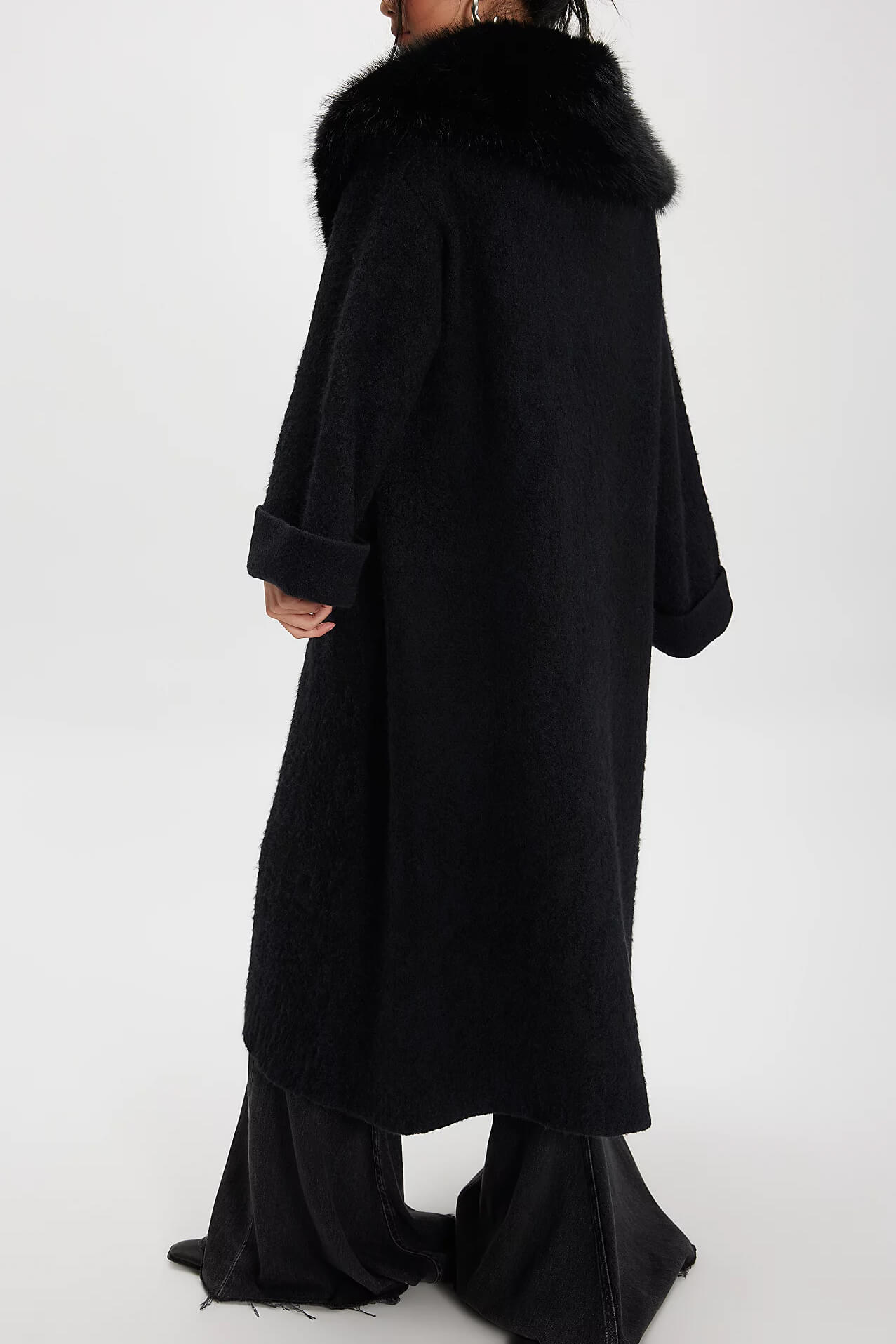 Black coat with fur collar on a white background