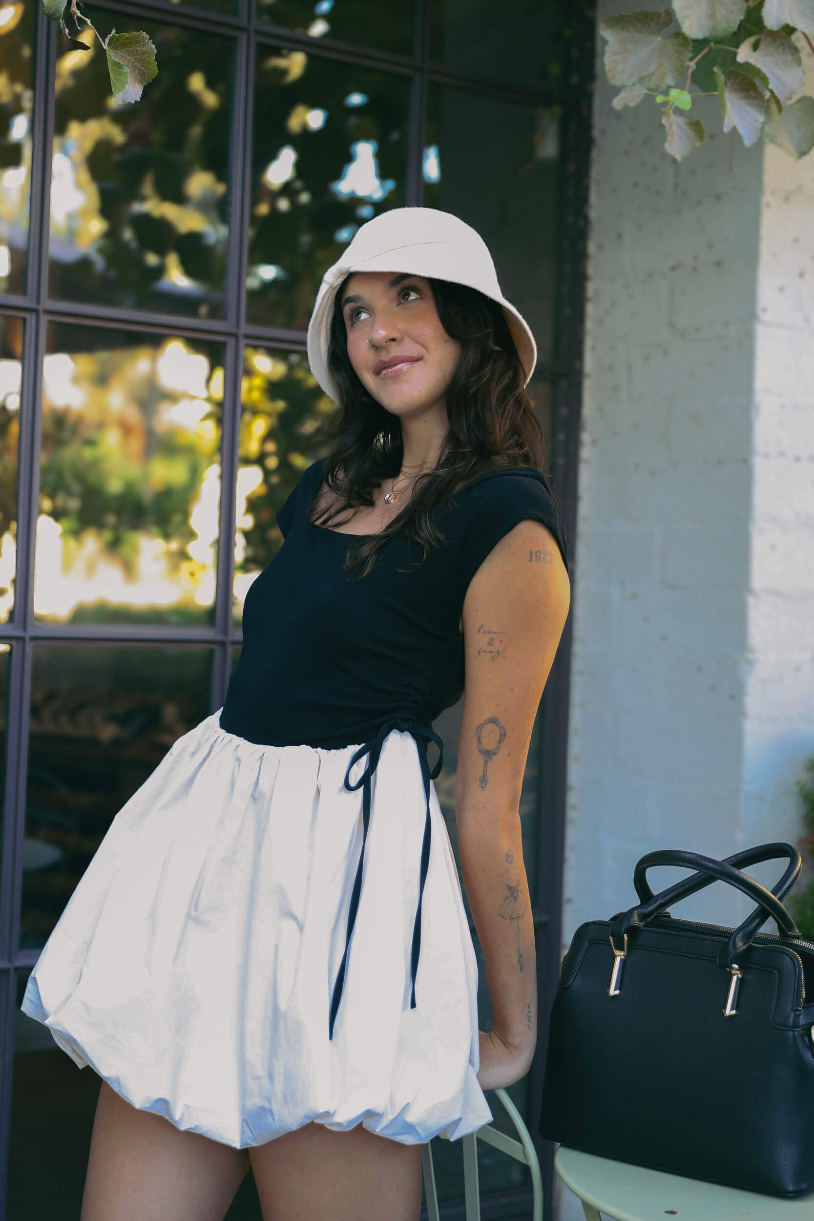 Womens cream colored cloche hat with front bow detail