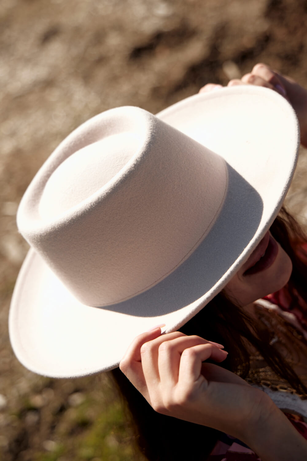 Women's ivory colored round top felt hat
