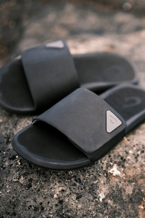 OluKai Ulele Slide in lava rock