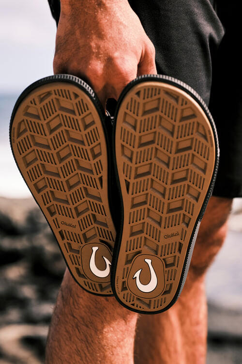 OluKai Ulele Slide in lava rock