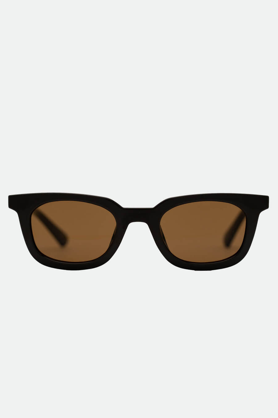Black sunglasses with brown lenses on a white background
