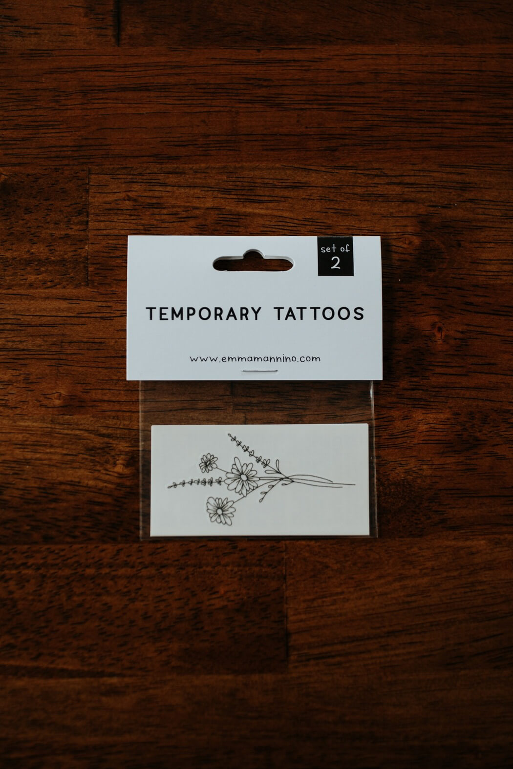 Saint & Company daisy tattoo