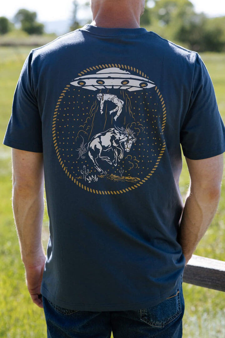 Sendero Charros and Aliens tee in navy. Sendero Provisions men’s fashion. Sendero Provisions women’s fashion. Western clothing for men. Western clothing for women. Wild West clothing for men. Wild West clothing for women. Texan fashion for men. Texan fashion for women. Western fashion for men. Western fashion for women. Sendero Provisions women’s bandana. Sendero Provisions men’s bandana. Sendero Provisions women’s hat. Sendero men’s hat. Sendero Provisions men’s shirt. Sendero Provisions accessories