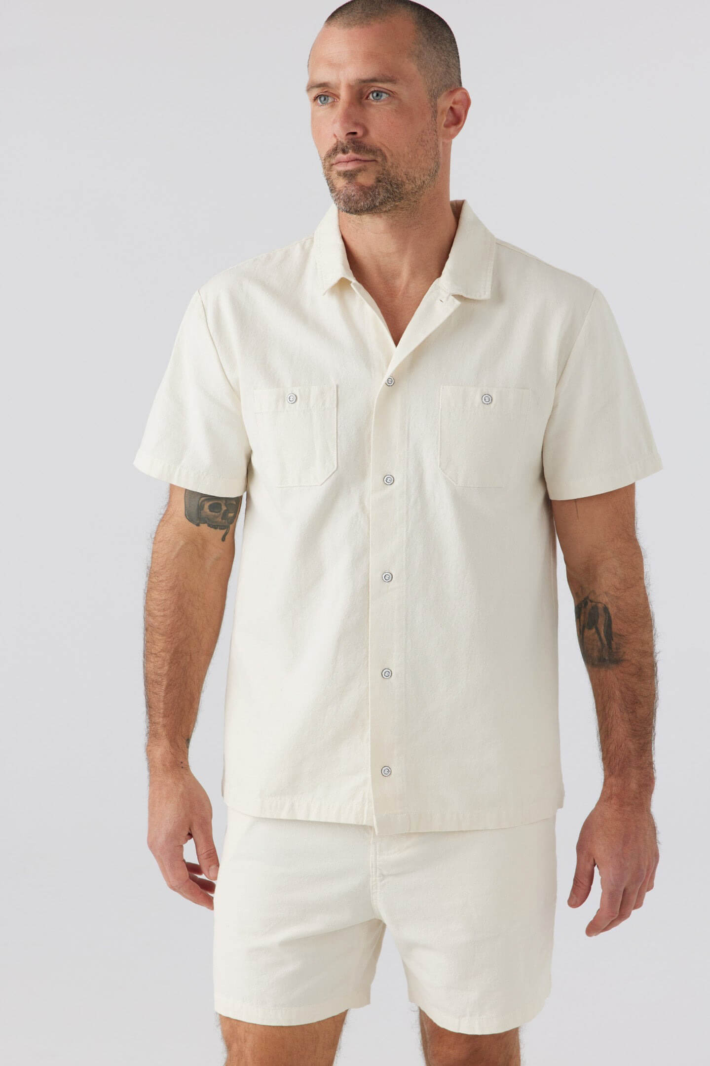 Sol Angeles Holloway short sleeve shirt in ecru. Sol Angeles men’s clothing. Casual men’s clothing. Upscale men’s clothing. Weekend clothing for men. Vacation clothing for men. Casual chic clothing for men. Men’s vacation clothing. Men’s weekend wear clothing. Linen clothing for men. Comfortable cotton clothing for men. Breathable clothing for men. Transition clothing for men. Casual button down shirts for men. Comfortable men's shirts.