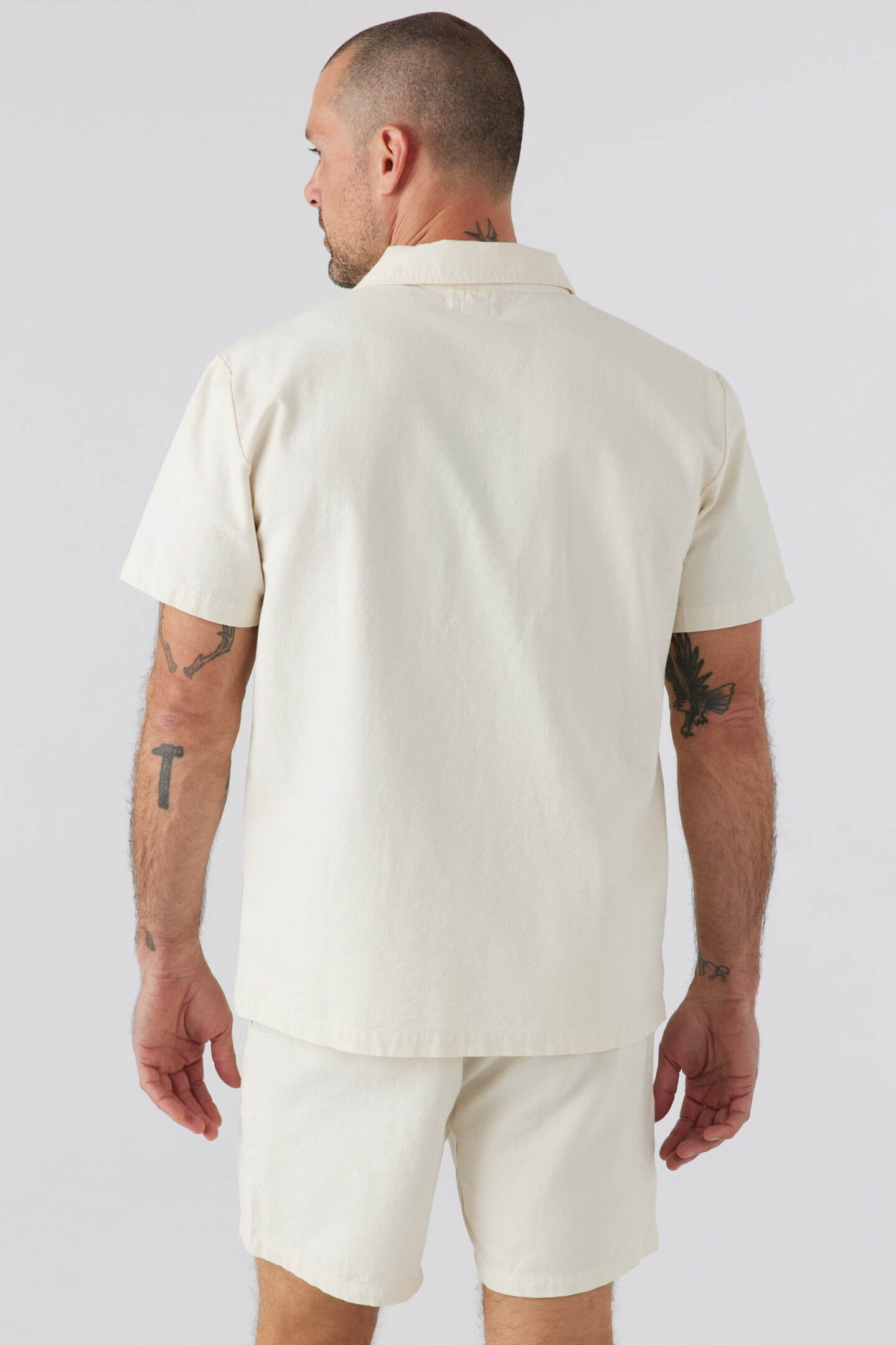 Sol Angeles Holloway short sleeve shirt in ecru. Sol Angeles men’s clothing. Casual men’s clothing. Upscale men’s clothing. Weekend clothing for men. Vacation clothing for men. Casual chic clothing for men. Men’s vacation clothing. Men’s weekend wear clothing. Linen clothing for men. Comfortable cotton clothing for men. Breathable clothing for men. Transition clothing for men. Casual button down shirts for men. Comfortable men's shirts.