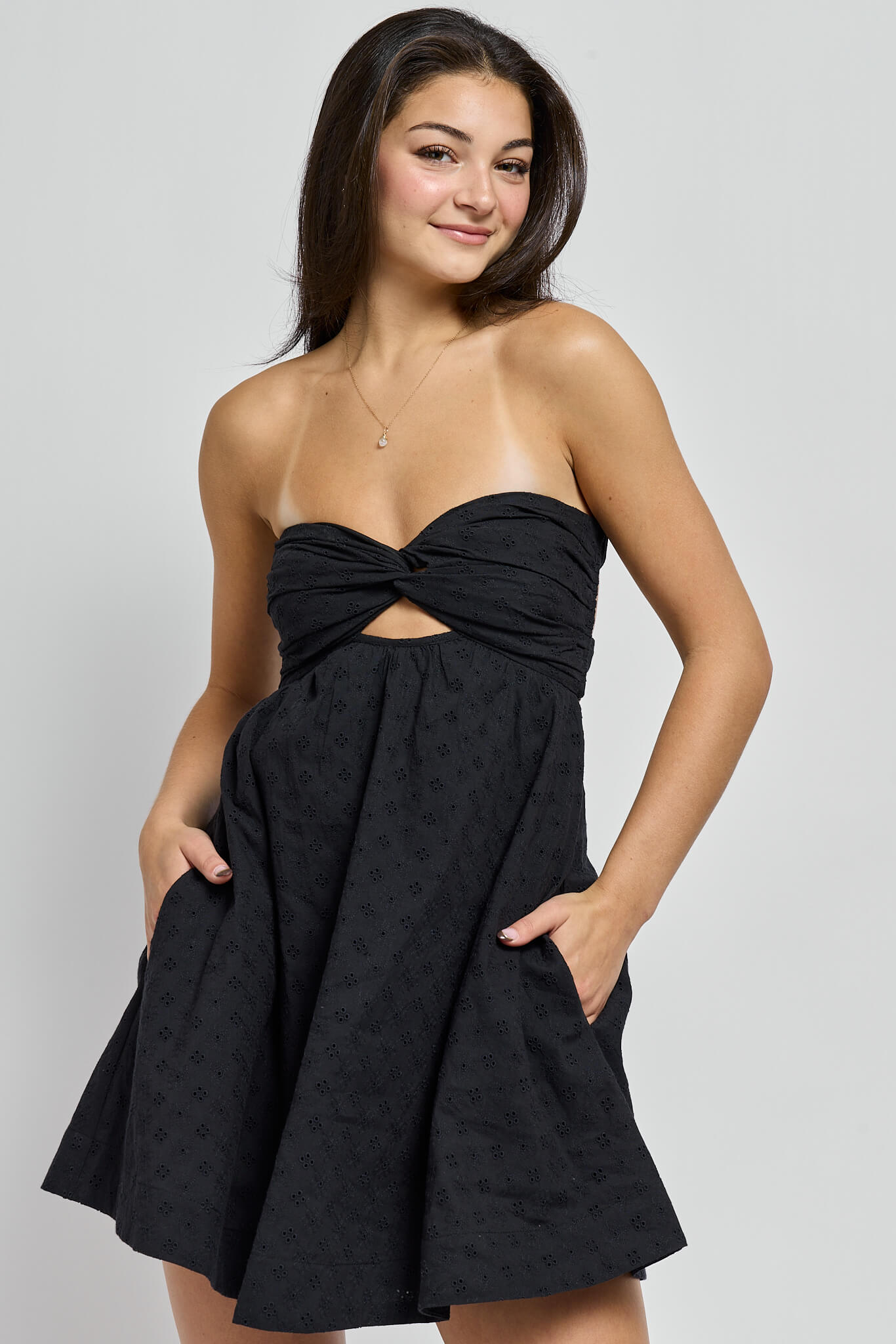 Womens strapless black mini dress with front cutout and eyelet detail