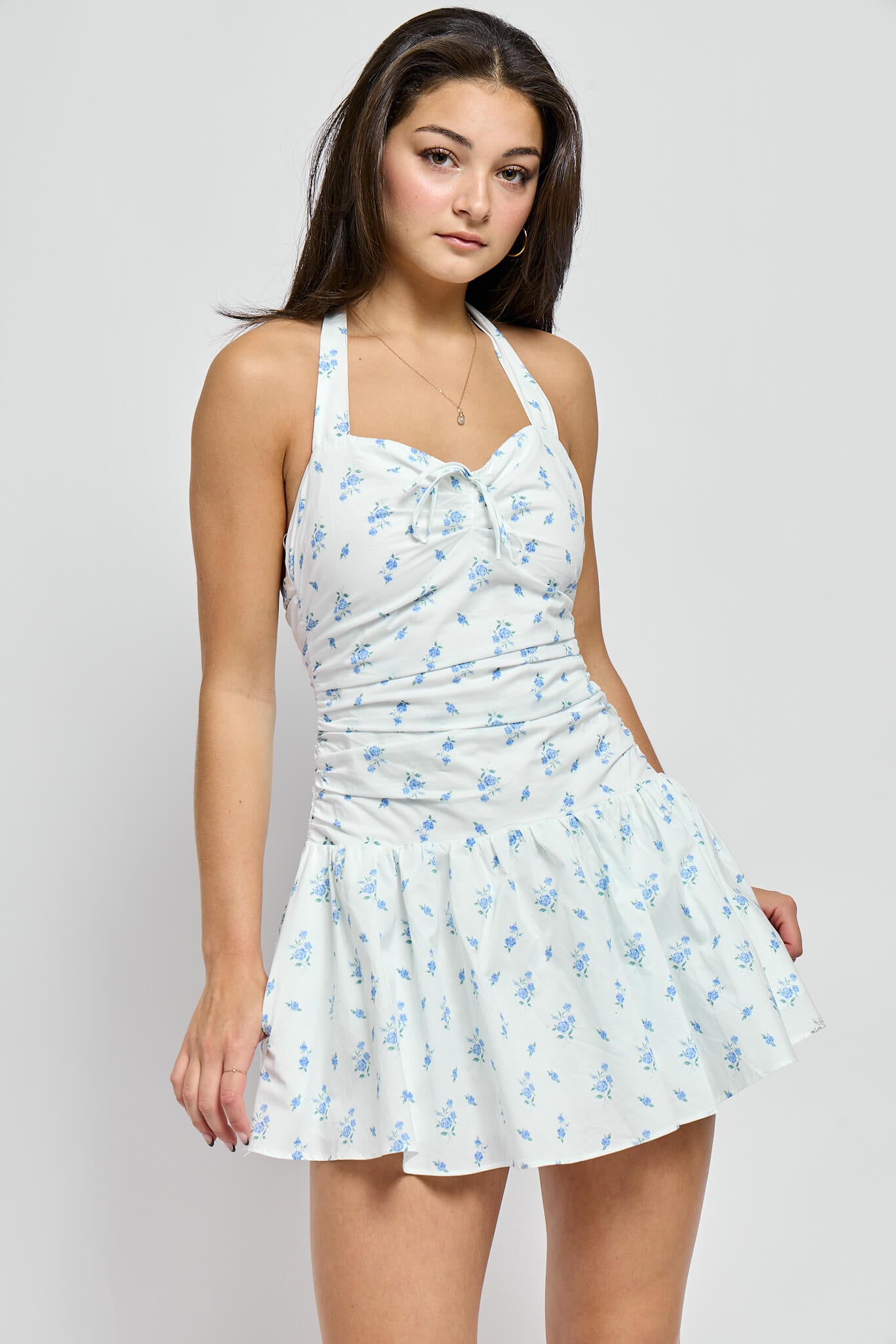 Womens white mini dress with soft blue floral print and halter neck