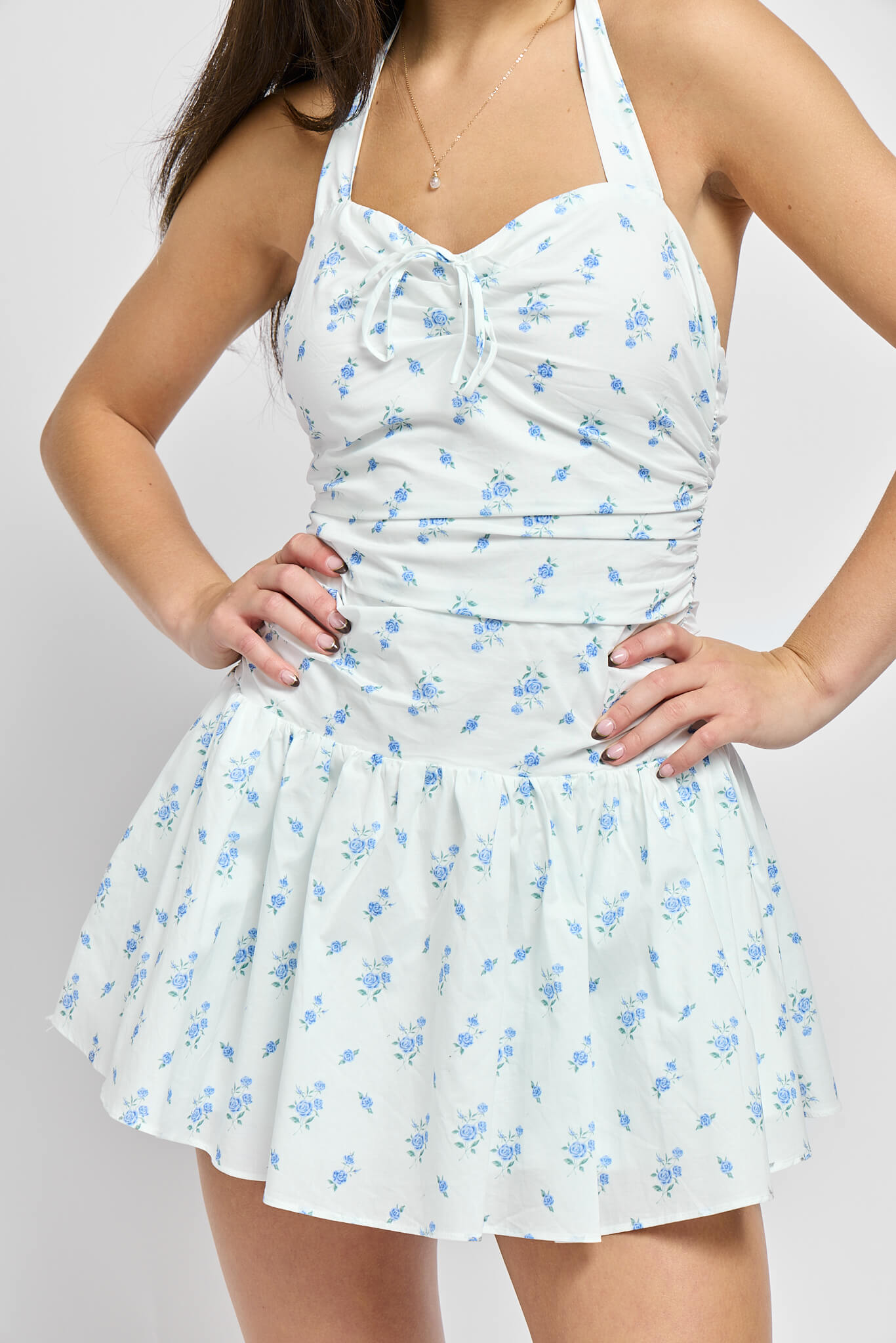 White sweetheart neckline halter mini dress with front small bow detail