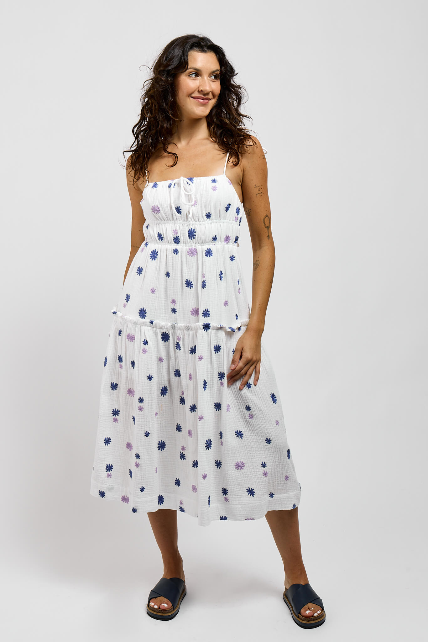 Womens white cotton dress with blue and purple embroidered flowers throughout