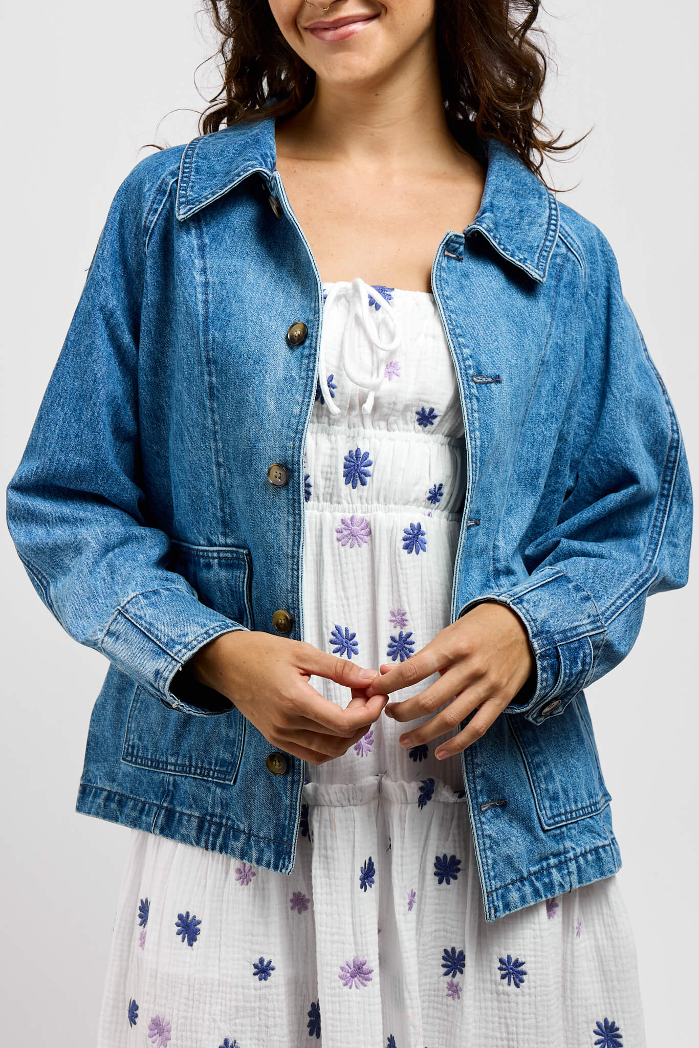 Womens button up front blue denim jacket with front pockets