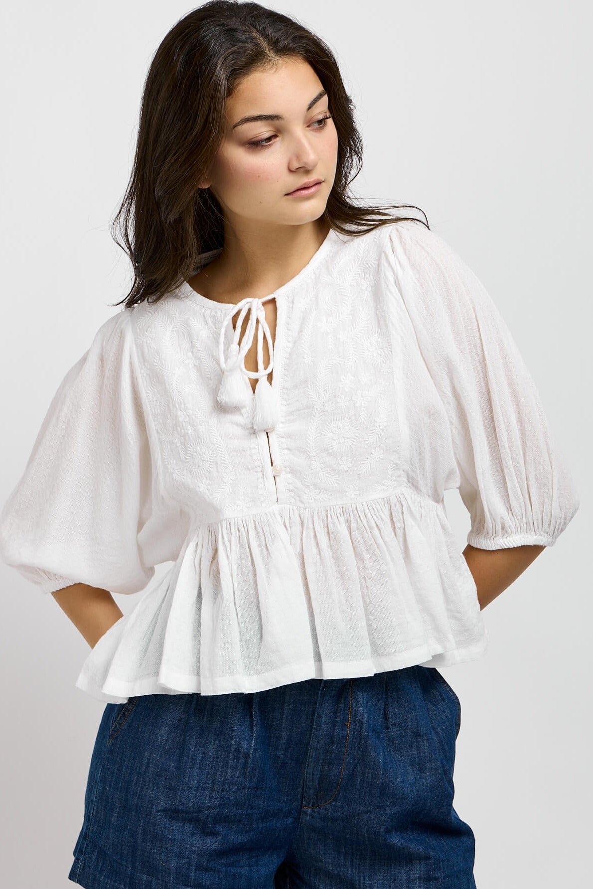Womens white top with white embroidery on front