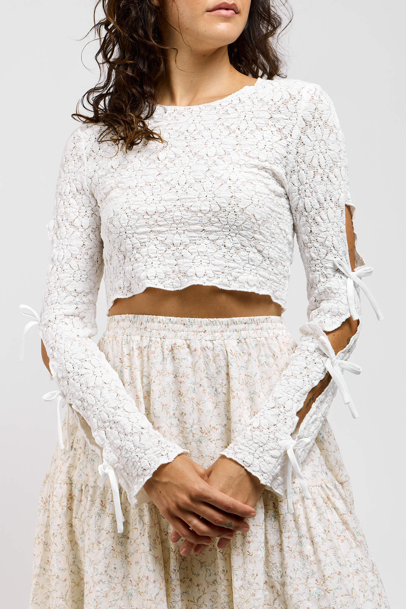 Womens white textured long sleeve shirt with open sleeve with bow ties